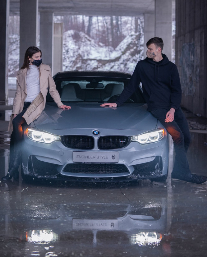man and woman with a BMW
