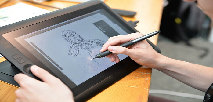 artist using technology to draw a character