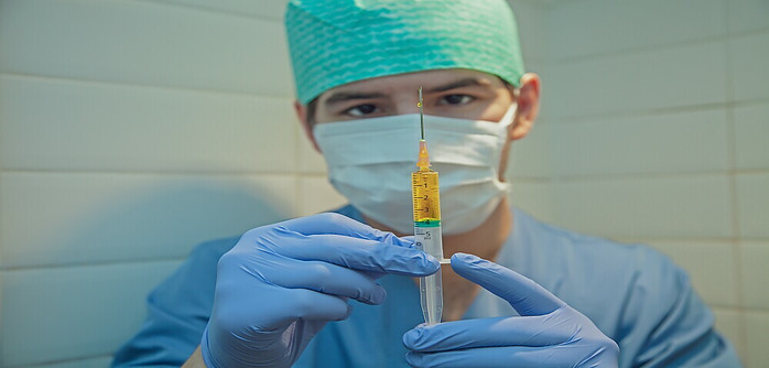 nurse holding a syringe