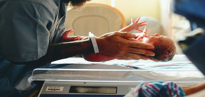 nurse with newborn baby