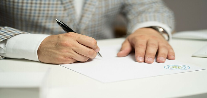 someone signing a document